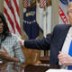 President Donald Trump holds an African American History Month listening session attended by Director of Communications for the Office of Public Liaison Omarosa Manigault (L) and other officials in the Roosevelt Room of the White House on February 1, 2017 in Washington, DC.